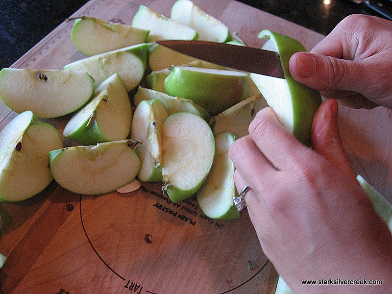 I like using a sharp paring knife to cut out the cork and apple skin.