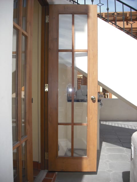 I had a question on the french doors and windows. When I saw these on our last visit down in Loreto, I was concerned because the wood strips was only on the outside of the doors. They have been fixed so that both sides now have the wood strips. I did noticed the door handles are knobs, not levers. I really hope the knobs are temporary construction knobs and will be replaced with the "real" ones when the home is turned over.