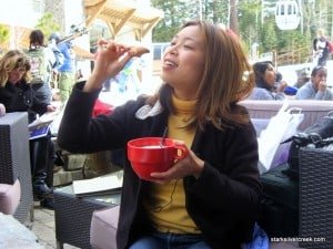 Loni demonstrates how to taste donuts at the base of Northstar