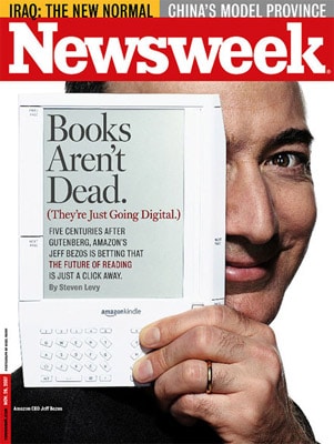 Jeff Bezos with the first generation Kindle, savior to the newspaper industry?
