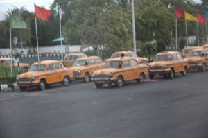 These taxis look like they were out of the 1950s or Cuba or a rip in the time-space continuum