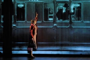 Kneehigh Theatre’s acclaimed production of Brief Encounter melds theater and film in unexpected ways: Laura (Hannah Yelland) waves goodbye to Alec (Milo Twomey) as he leaves on his train. Photo by Kevin Berne.