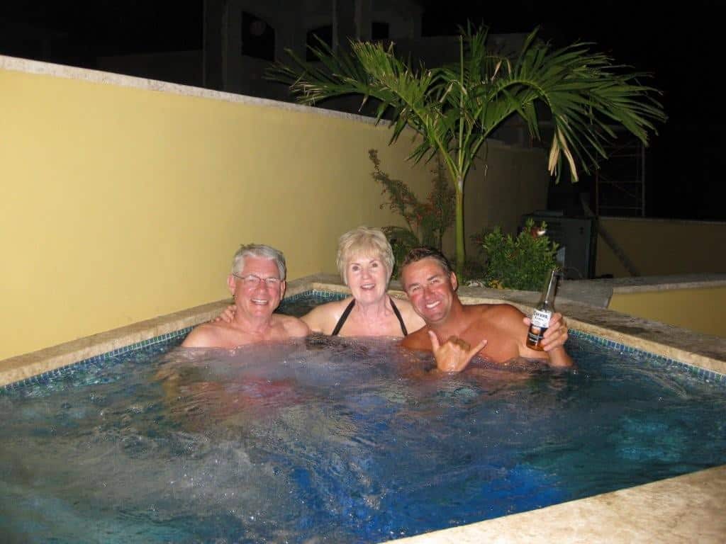 Bill and Julie Thompson enjoy with Greg Gordon their first soak in their new solar heated hot tub!