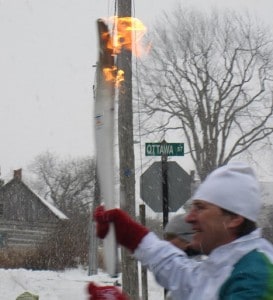 Olympic Torch Bearer, Brian Carty, runs 300m leg of the relay in the town of Almonte. 