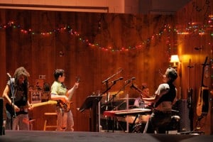 At Berkeley Rep, a rocking four-piece band supports the world premiere of Girlfriend: (l to r) Shelley Doty on lead guitar, Jean DuSablon on bass, ieela Grant on drums and Julie Wolf on rhythm guitar and keyboards. Photo courtesy of kevinberne.com