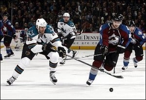 San Jose Sharks center Joe Thornton, left, steals the puck from Colorado Avalanche right winger Marek Svatos, of Slovakia, in the first period of Game 4 of the teams' NHL Western Conference first-round playoff series in Denver on Tuesday, April 20, 2010. (AP Photo/David Zalubowski) (David Zalubowski - AP)