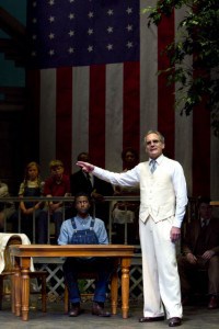 Atticus Finch (Anthony Newfield, standing right) gives his closing remarks in the case of Tom Robinson (Philipe D. Preston, seated) in Christopher Sergel's adaptation of Harper Lee's timeless American classic, TO KILL A MOCKINGBIRD at TheatreWorks. Photo Credit Mark Kitaoka