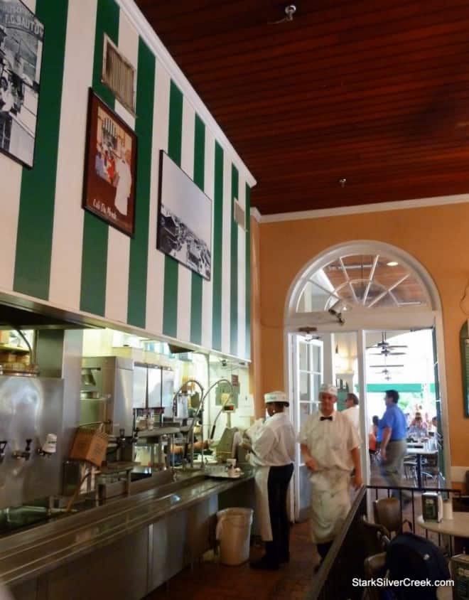 Café du Monde waiters in white uniforms taking a break