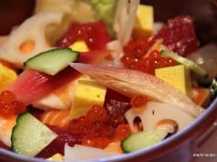 Morimoto's Chirashi comes in a deep red bowl. You could eat it with chopsticks, but I found the use of a long spoon much more satisfying.