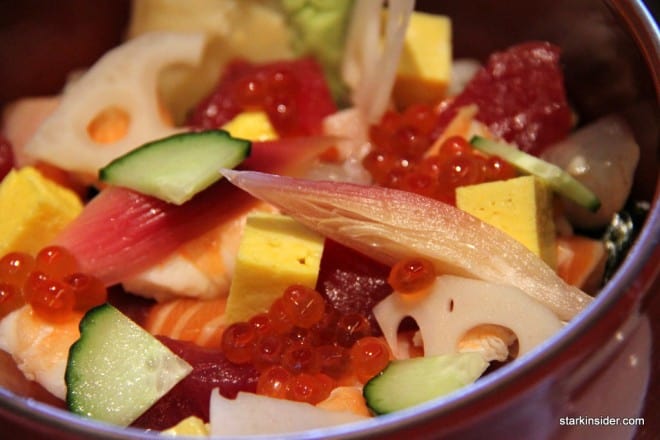 Morimoto's Chirashi comes in a deep red bowl. You could eat it with chopsticks, but I found the use of a long spoon much more satisfying.