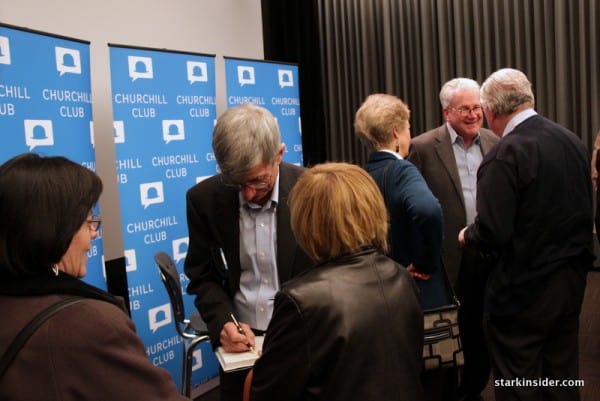 Bill Davidow signs copies of his new book "Overconnected" after the presentation