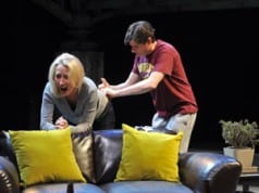 David (Gabriel Marin*) reluctantly gives Hannah (Carrie Paff*) a hormone shot in the National New Play Network Rolling World Premiere of Collapse
