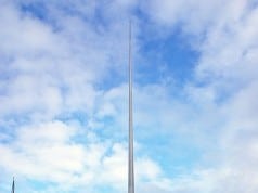 The Spire of Dublin rises behind the statue of Jim Larkin.