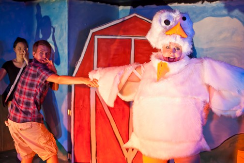 Emory (Charlie Cromer, middle) does a dance routine with his chicken friend Linda (Sarah Coykendall) as the narrator (Cindy Im) looks on in MilkMilkLemonade, a warped tale of innocence lost at Impact Theatre
