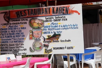 Colorful menus at the taco stands.