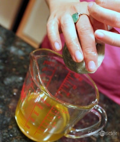 Separating lavender oil from lavender flowers. Two layers of cheesecloth is the best way to get all of the oil from the lavender and oil mixture.