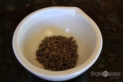 Lavender flowers are placed in a mortar. I use a porcelain mortar. Depending on how much lavender you harvested, you may want to process the flowers in batches. I would not fill the mortar more than halfway with lavender flowers. Lavender flowers are placed in a mortar.