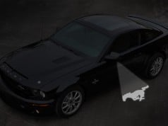 Ford fits 2013 Mustang with tiny projector that projects logo 2013 Ford Mustang