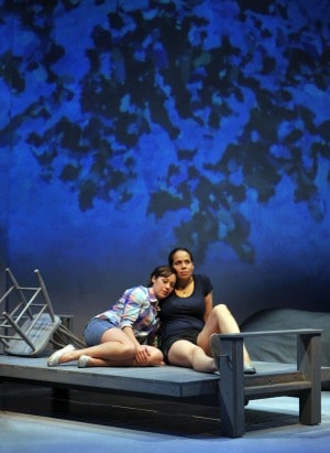 Suze (l. Blythe Foster) and Magz (r. Lauren Spencer) share a moment on the dock