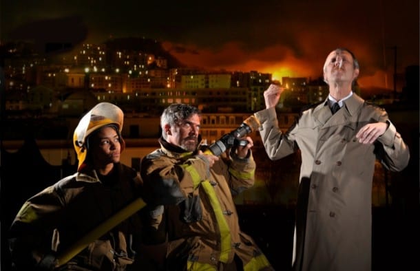 Firefighters (l, Tristan Cunningham, c, Kevin Clarke) try to stop Mr. Biedermann (r, Dan Hiatt) from lighting his cigarette in Aurora Theatre Company’s The Arsonists