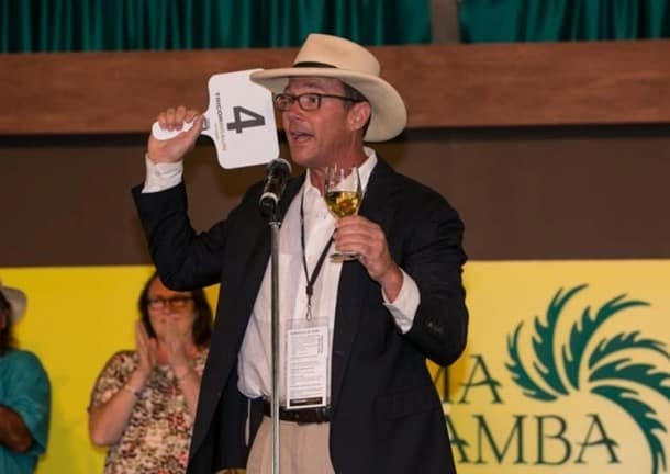 Matt Gallo, of the Gallo Family (2013 Sonoma Wine Country Weekend Honorary Vintner Chairs), motivates the crowd on stage at the Sonoma Harvest Wine Auction