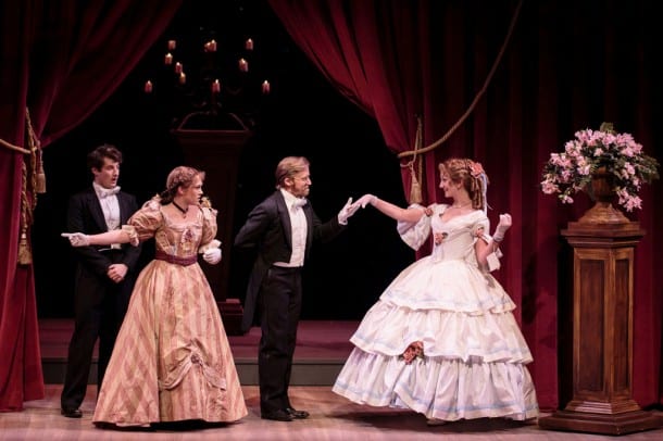 (l-r) Laurie (Matt Dengler) looks on in amusement and Jo (Emily Koch) argues as John Brooke (Justin Buchs) asks Meg (Sharon Rietkerk) to dance in TheatreWorks' holiday musical LITTLE WOMEN, playing December 4 - January 4 at the Lucie Stern Theatre in Palo Alto.