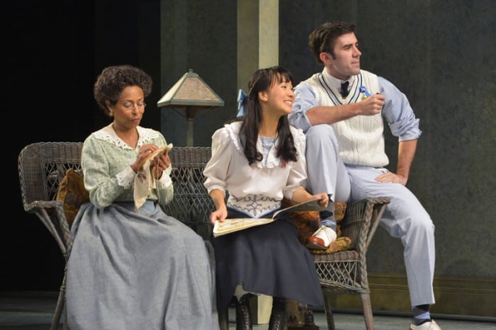 (Left to right) Lily Miller (Margo Hall), Mildred Miller (Christina Liang), and Arthur Miller (Michael McIntire) listen to Nat Miller (not pictured) in Eugene O'Neill's Ah, Wilderness!, performing at A.C.T.'s Geary Theater through Sunday, November 8.