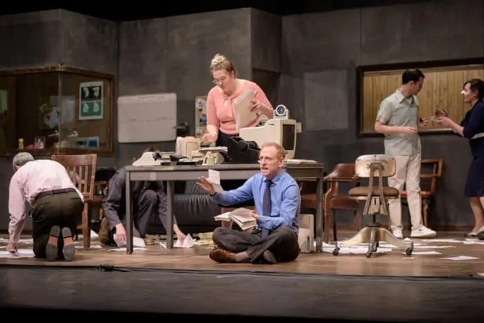 Scott Shepherd (foreground) and ensemble in Elevator Repair Service’s production of Gatz, directed by John Collins. Photo by Ian Douglas