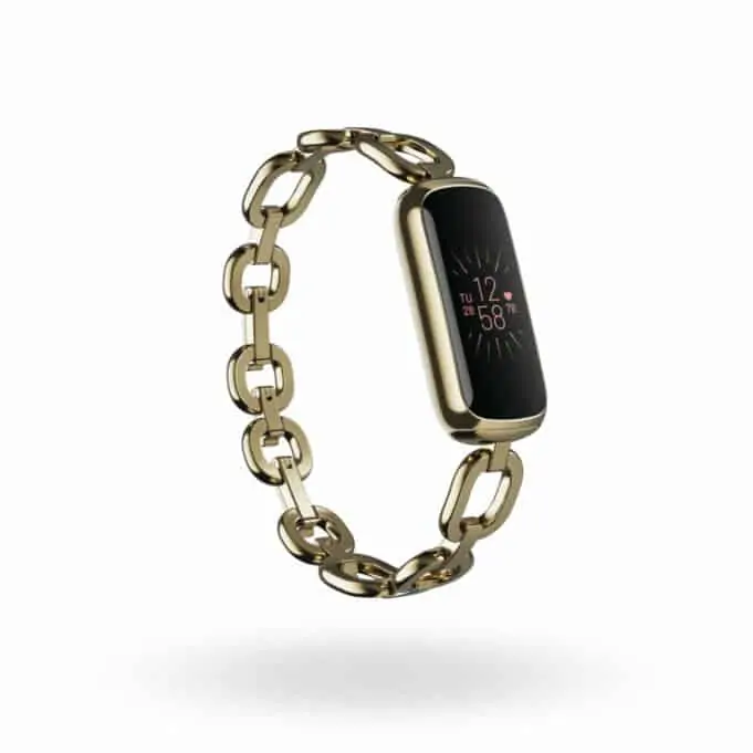 Fitbit Luxe fitness and wellness tracker with soft gold stainless steel gorjana Parker link bracelet
