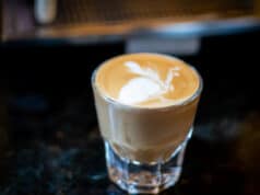 Home Espresso: A Cortado in a Gibraltar glass is pure luxury Cortado espresso served in a Gibraltar glass on a dark countertop, showcasing creamy microfoam and rich crema