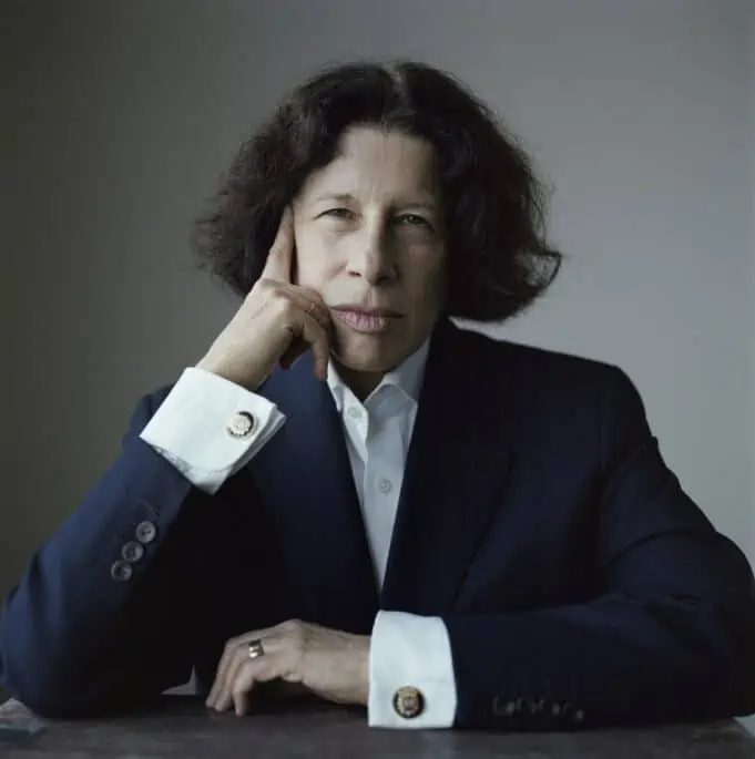 Lebowitz worked odd jobs, such as taxi driving, belt peddling, and apartment cleaning (“with a small specialty in Venetian blinds”), before being hired by Andy Warhol as a columnist for Interview. That was followed by a stint at Mademoiselle. Her first book, a collection of essays titled Metropolitan Life, was a bestseller, as was a second collection, Social Studies. 