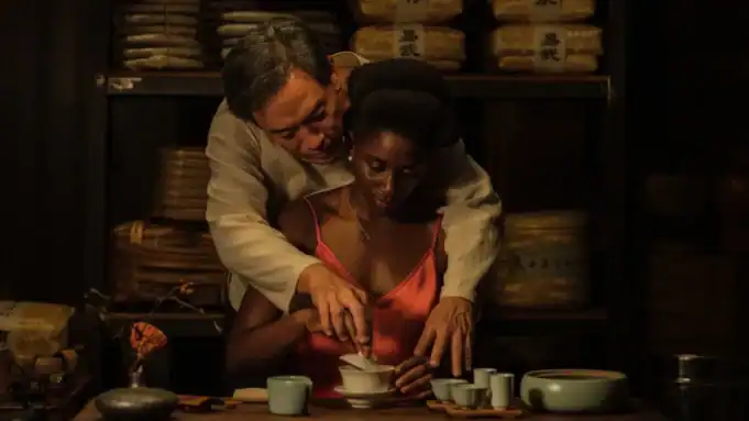 A tender moment during a tea ceremony between a man and woman, from the film Black Tea