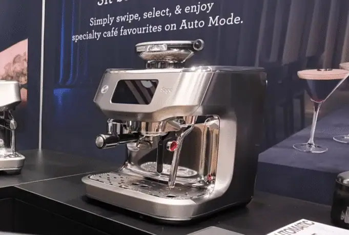 Wide shot of the Breville Oracle Dual Boiler espresso machine on a counter at a trade show