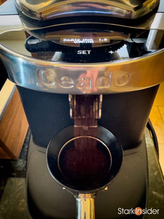 Fresh espresso grounds from Ceado grinder during dose prep