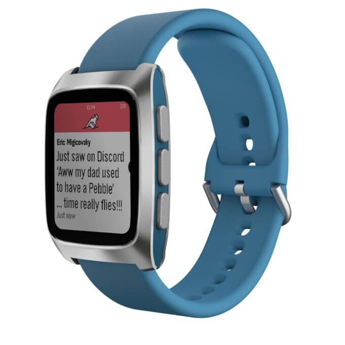 Close-up of Pebble Time 2 smartwatch with blue silicone strap, showing a text notification on its color e-paper display.