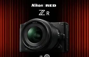 Nikon ZR cinema camera – Nikon and RED collaboration featuring full-frame body with NIKKOR Z lens against cinematic red curtain backdrop.