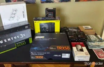 AI lab hardware parts laid out on table including RTX 5090 GPU, ASUS TRX50 motherboard, and Threadripper box.