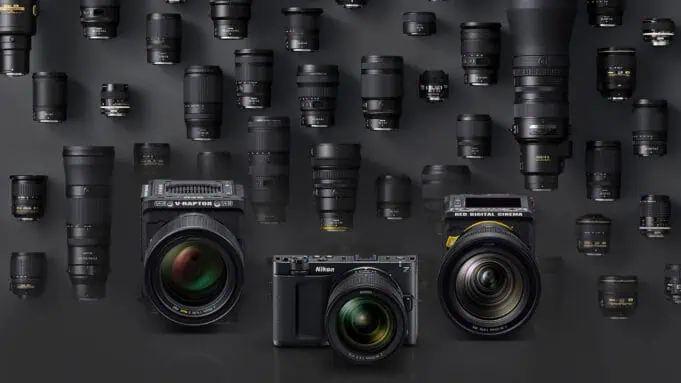 Nikon ZR and RED V-Raptor cinema cameras displayed with a wide selection of NIKKOR Z lenses, highlighting the versatility of the Z-mount system for filmmakers.
