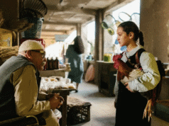 The President’s Cake — a haunting portrait of Iraq’s marshlands Scene from The President’s Cake — Lamia (Baneen Ahmad Neyyef) speaks with a vendor while holding a rooster in an Iraqi market.