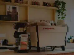 La Marzocco espresso machine with Swan grinder on a home kitchen counter