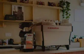 La Marzocco App Adds Smart Schedule and Local Mode La Marzocco espresso machine with Swan grinder on a home kitchen counter