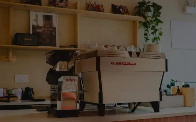 La Marzocco espresso machine with Swan grinder on a home kitchen counter