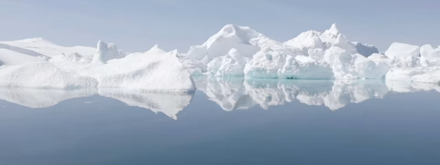 Abstract glacial ice formations in blue and white showing melting patterns from MELT documentary